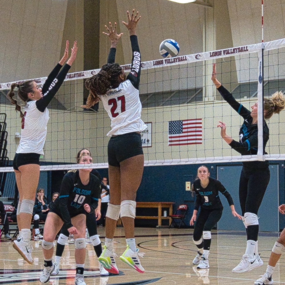 MPC Women's Volleyball Players Jumping at Net to Block Volleyball