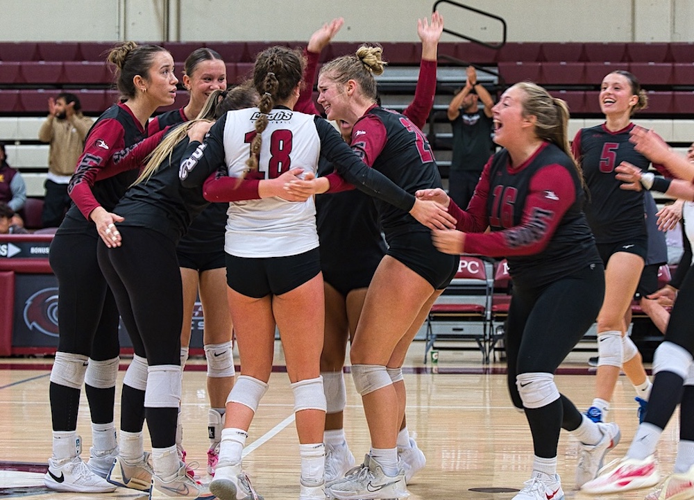 MPC Volleyball Team Cheering Together at Game